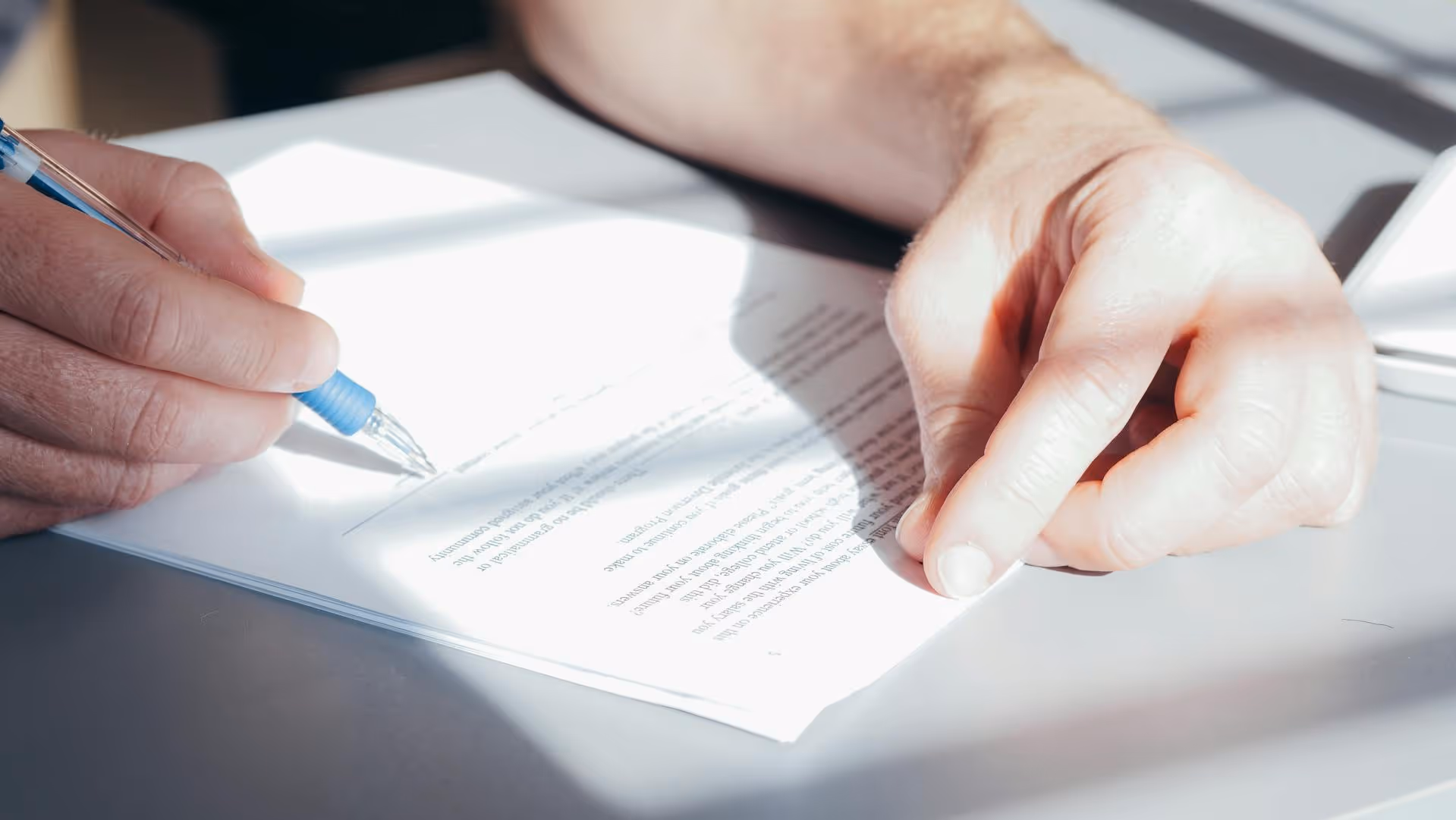 Person signing a letter