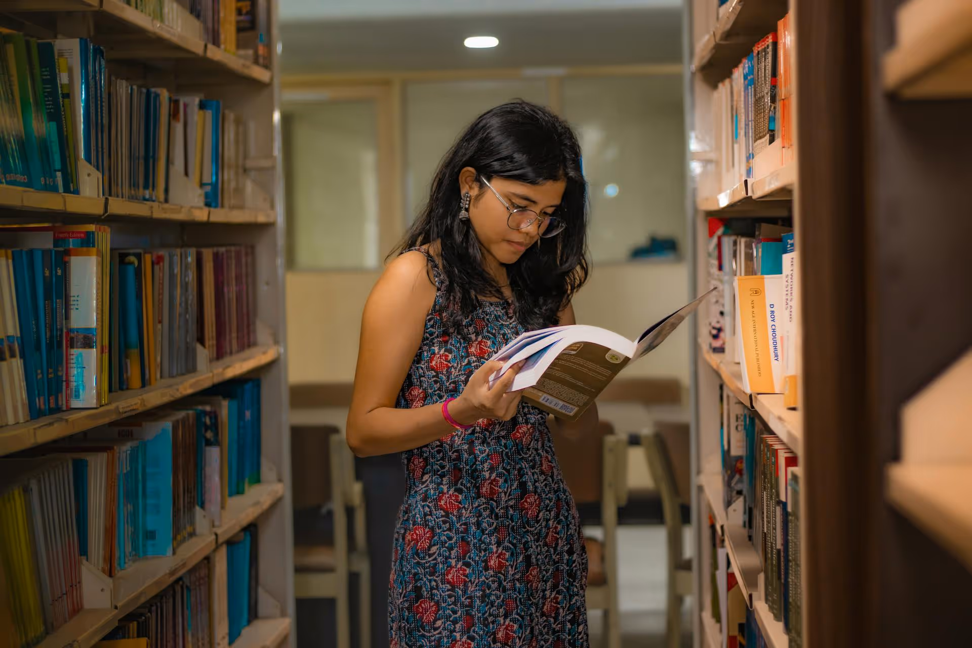 International student reading in library