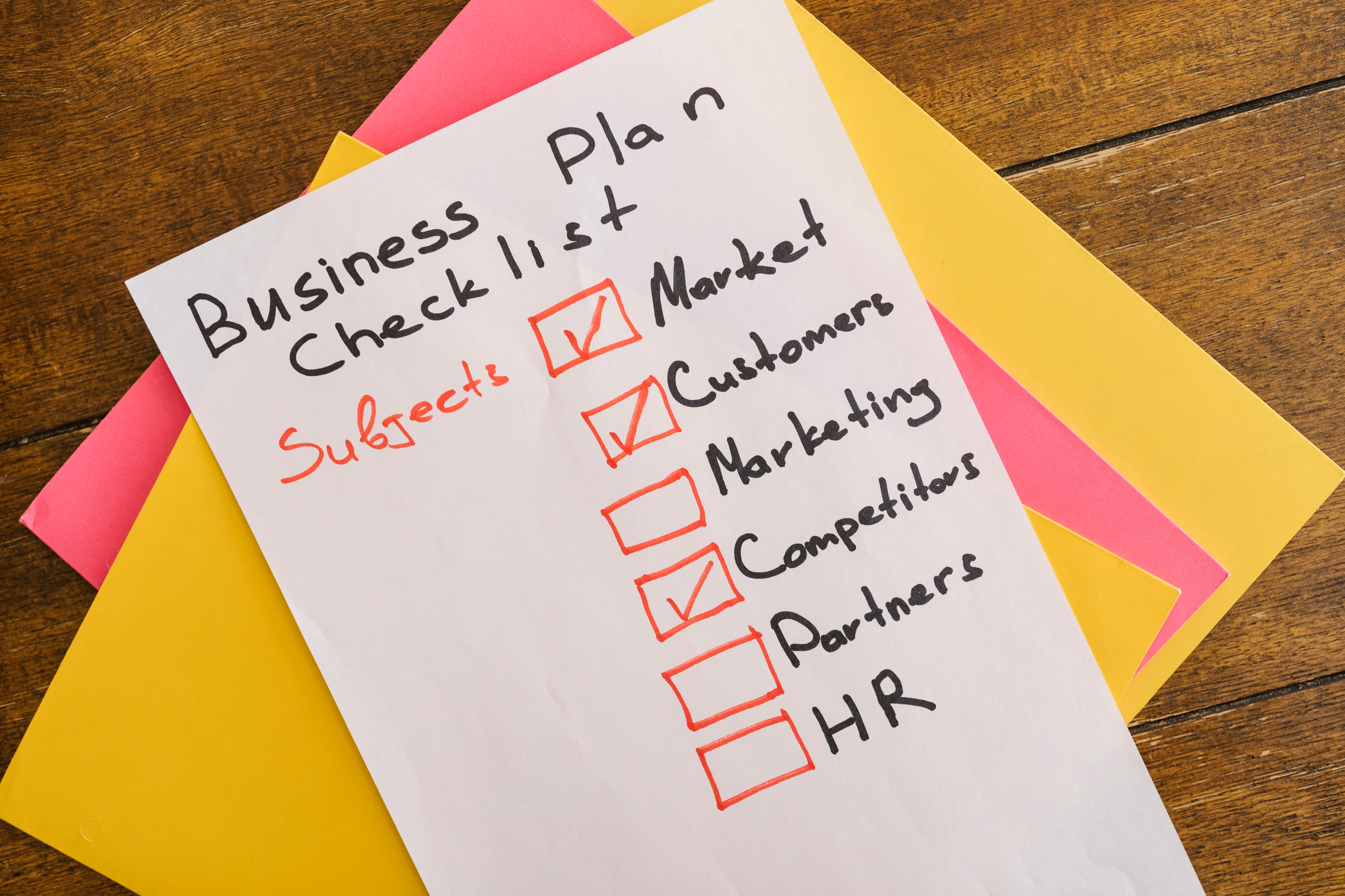Business plan checklist on paper