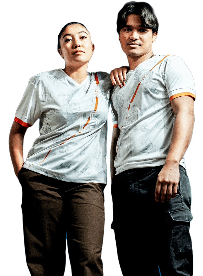 Two people wearing white sports jerseys with orange accents standing side by side, one with a hand on the other's shoulder.