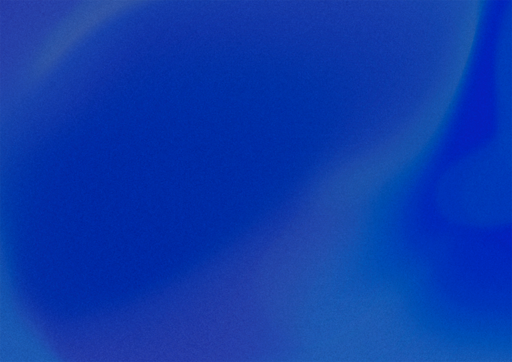 Abstract smooth gradient background blending various shades of blue and purple.