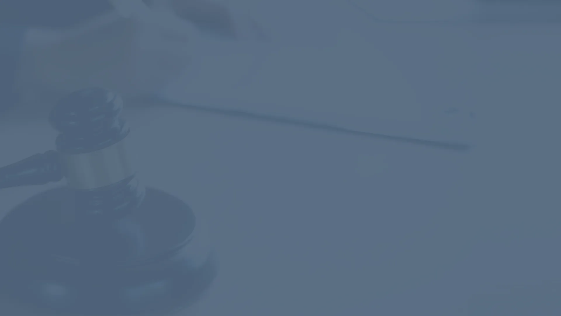A washed out image of a gavel in a courtroom