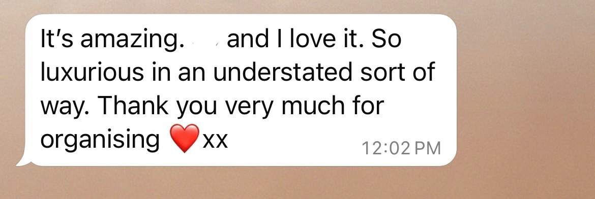 A text message screenshot showing a white message bubble with the text 'It's amazing and I love it. So luxurious in an understated sort of way. Thank you very much for organising', followed by a red heart emoji.