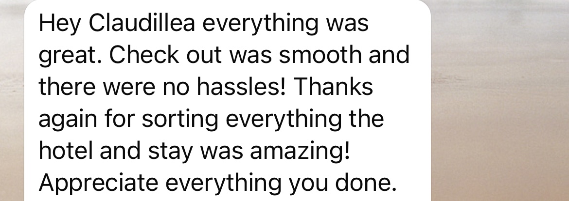 A text message bubble containing a thank you note that reads: 'Hey Claudillea everything was great. Check out was smooth and there were no hassles! Thanks again for sorting everything the hotel and stay was amazing! Appreciate everything you done.'