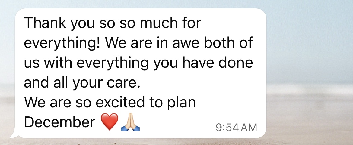A text message bubble containing a thank you note that reads 'Thank you so so much for everything! We are in awe both of us with everything you have done and all your care. We are so excited to plan December' followed by a red heart emoji and praying hands emoji.