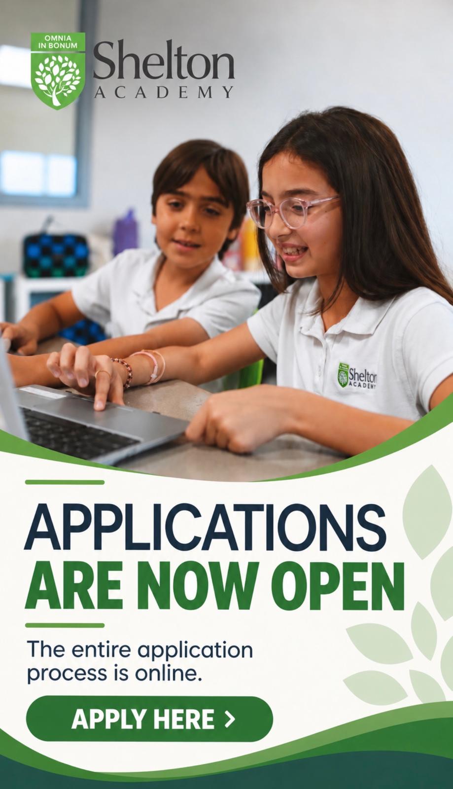Two school children, a girl and a boy, in white Shelton Academy uniforms, working on a laptop together indoors, with text announcing 'Applications are now open' and an online application invitation with an 'Apply Here' button.
