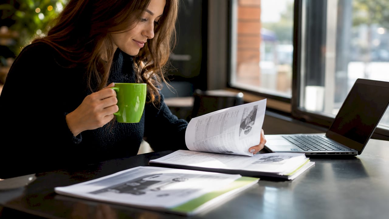 Woman reviewing rebuilt title truck documents