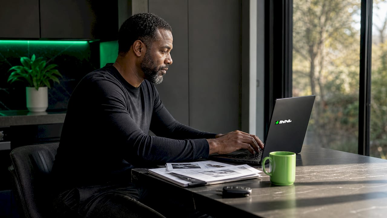 Man checking car trade-in value on laptop