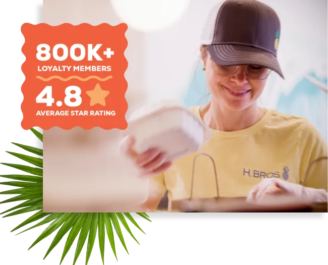 A Hawaiian Bros employee bagging a takeout order; badge reads "750K+ loyalty members, 4.7 average star rating"