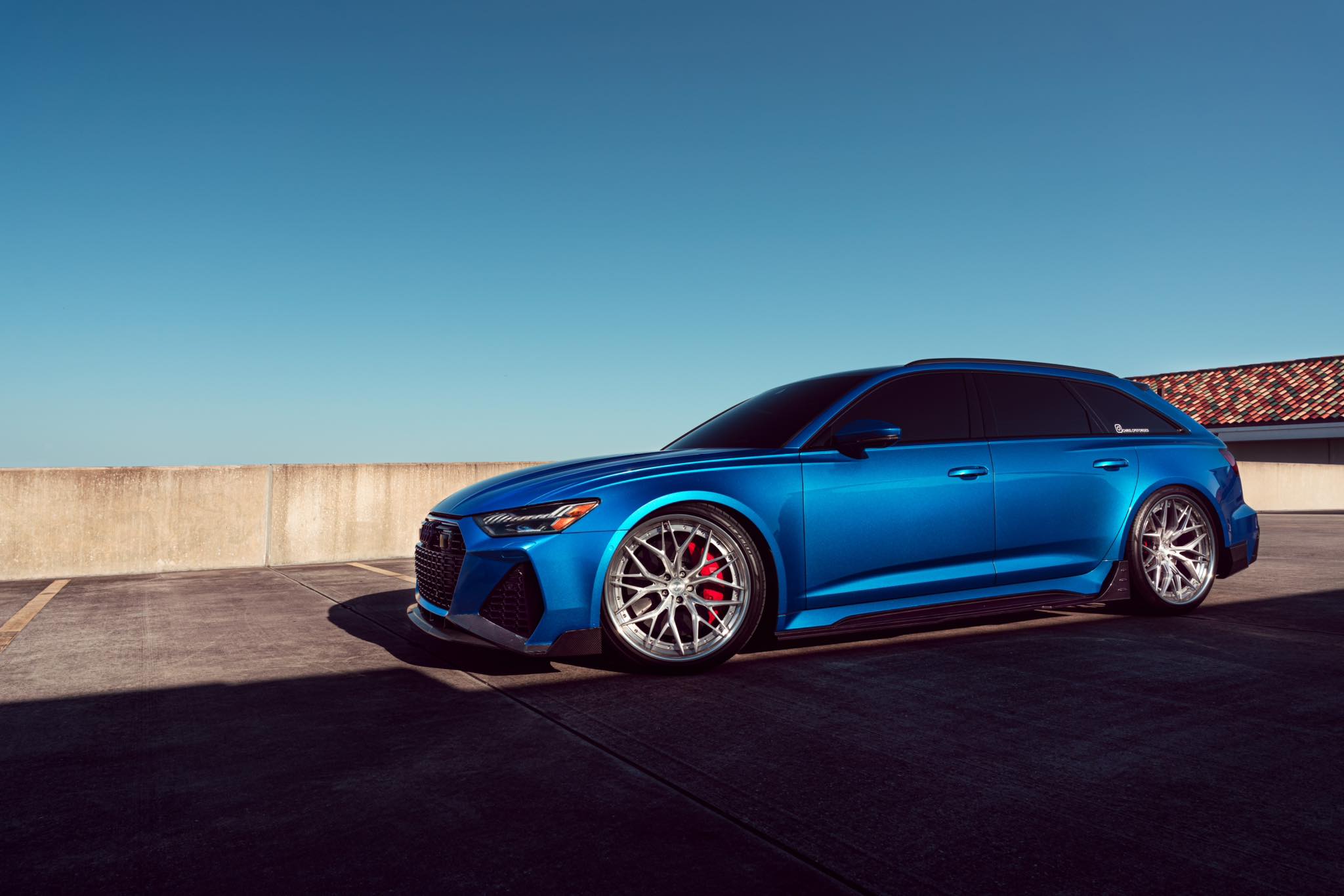 Silver Cooke Forged wheels on blue Audi