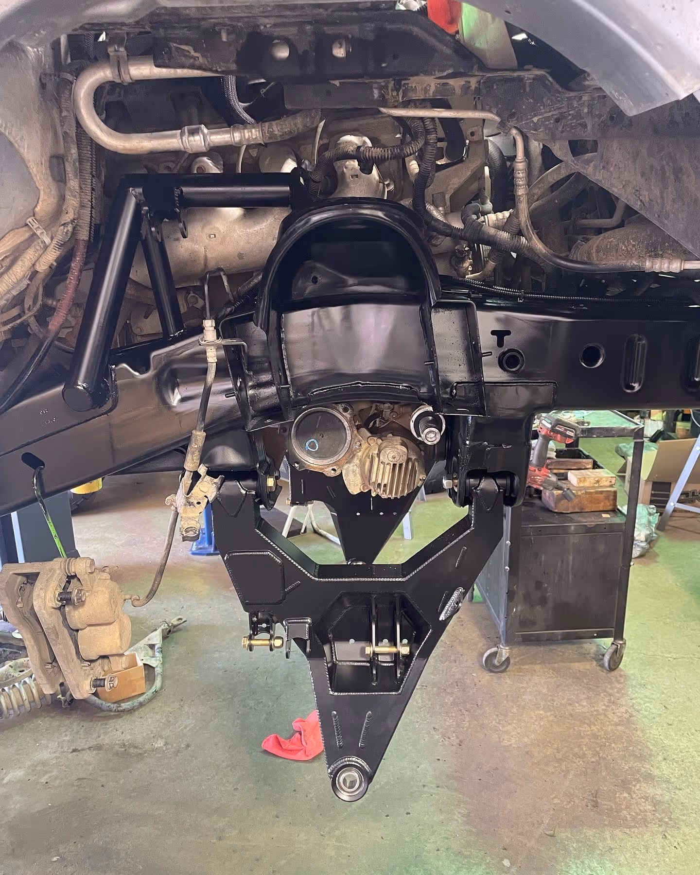 Car suspension and steering components during repair in auto workshop