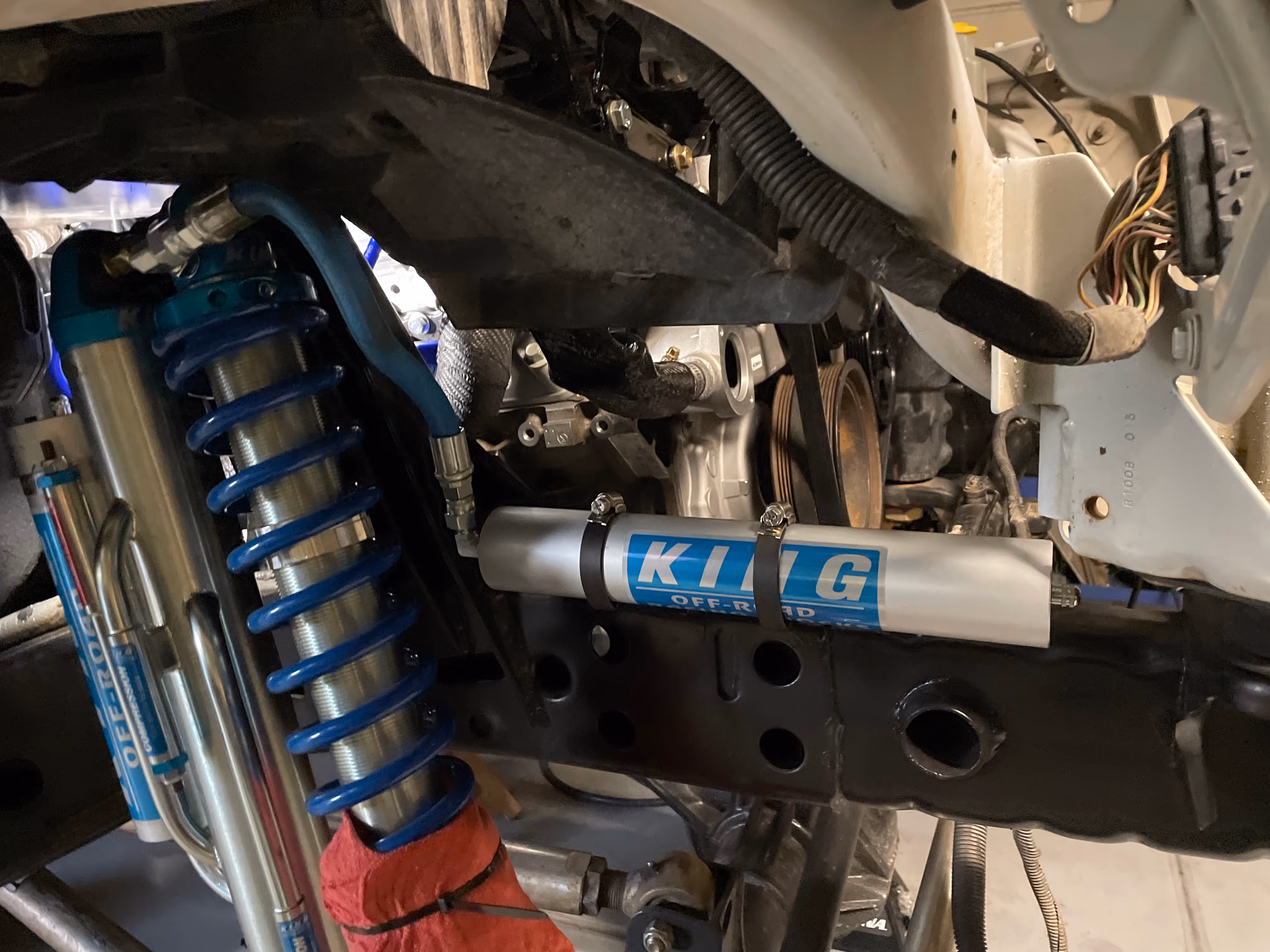 King off-road shock absorber with blue spring in vehicle suspension