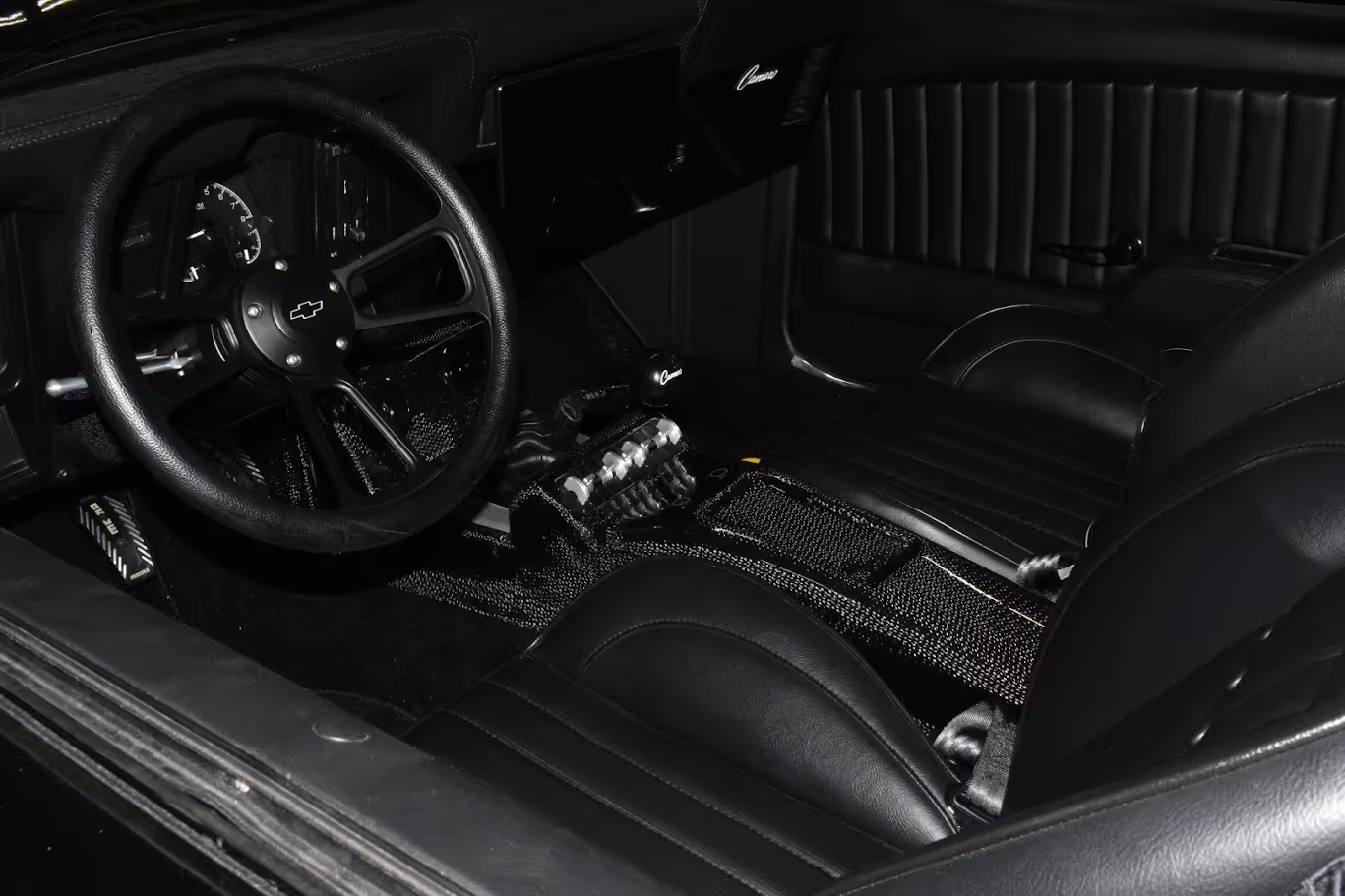 Black and white interior of classic Chevrolet with leather seats