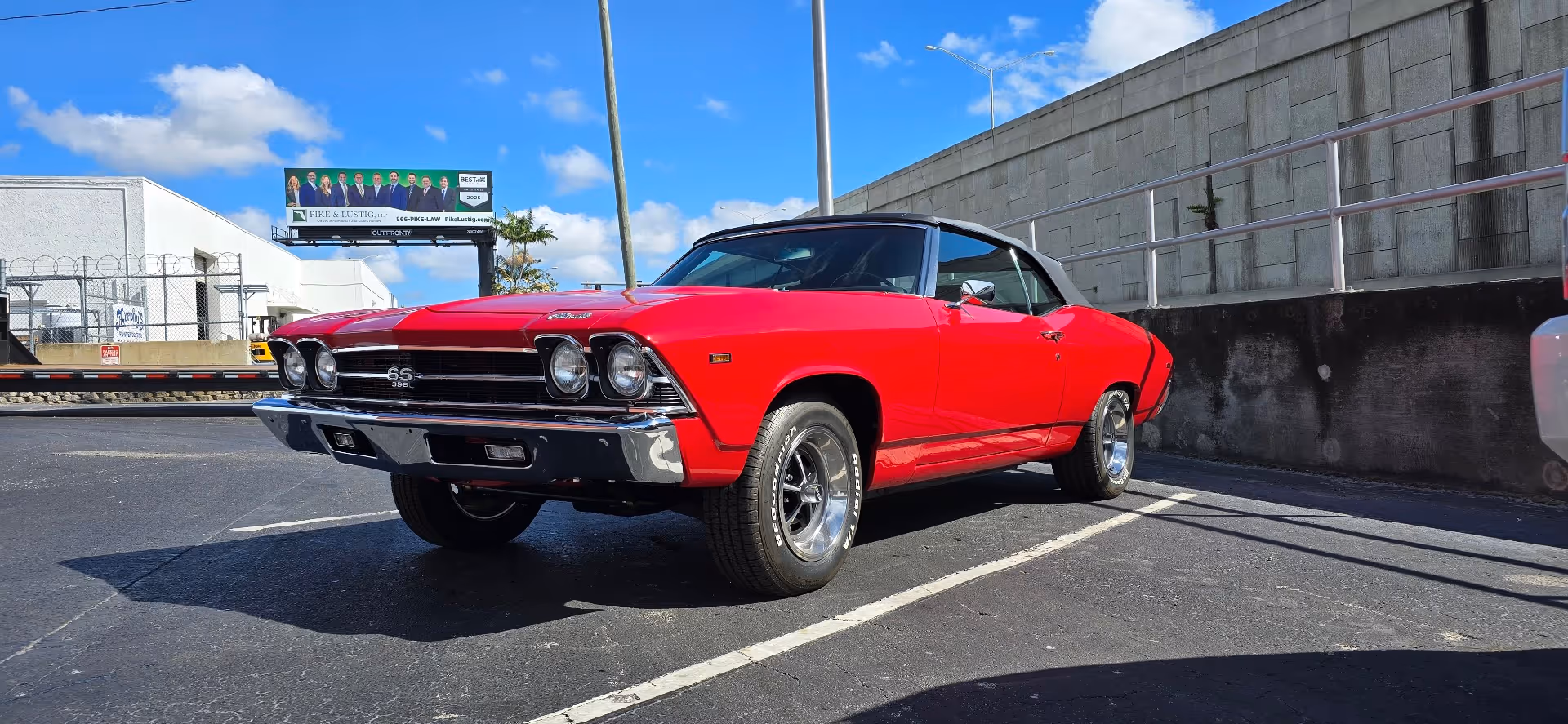 Bright red classic Chevrolet Chevelle SS muscle car parked outdoors