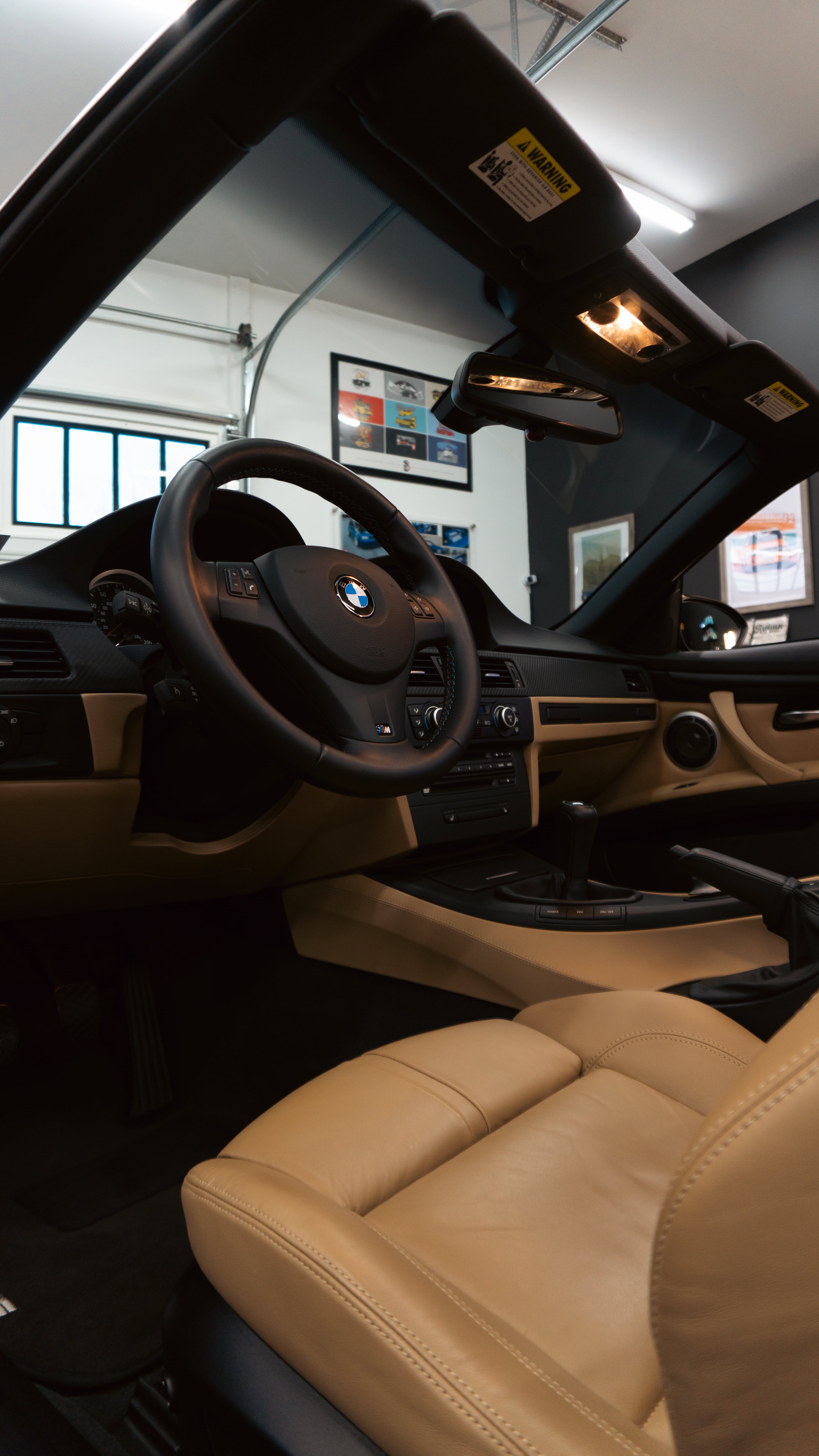 BMW interior with leather seats and steering wheel in modern showroom