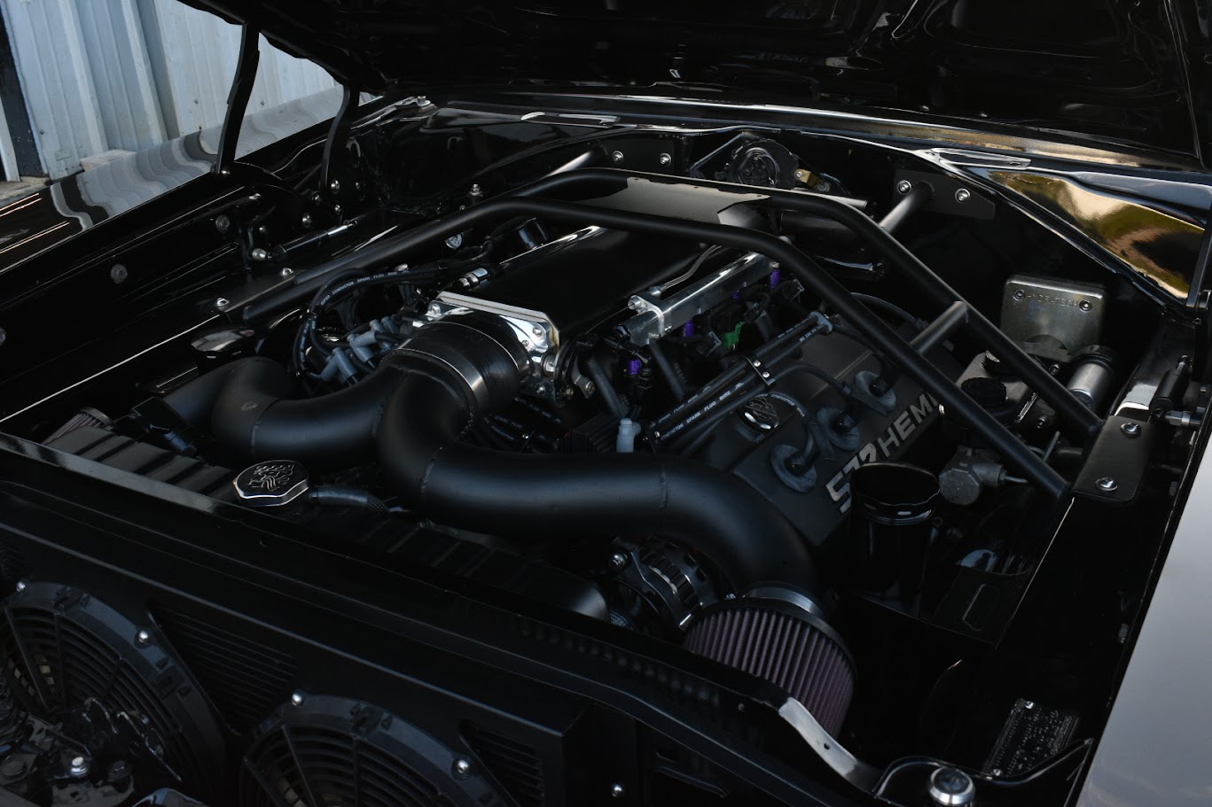 Close-up of a powerful V8 engine under the hood of a muscle car