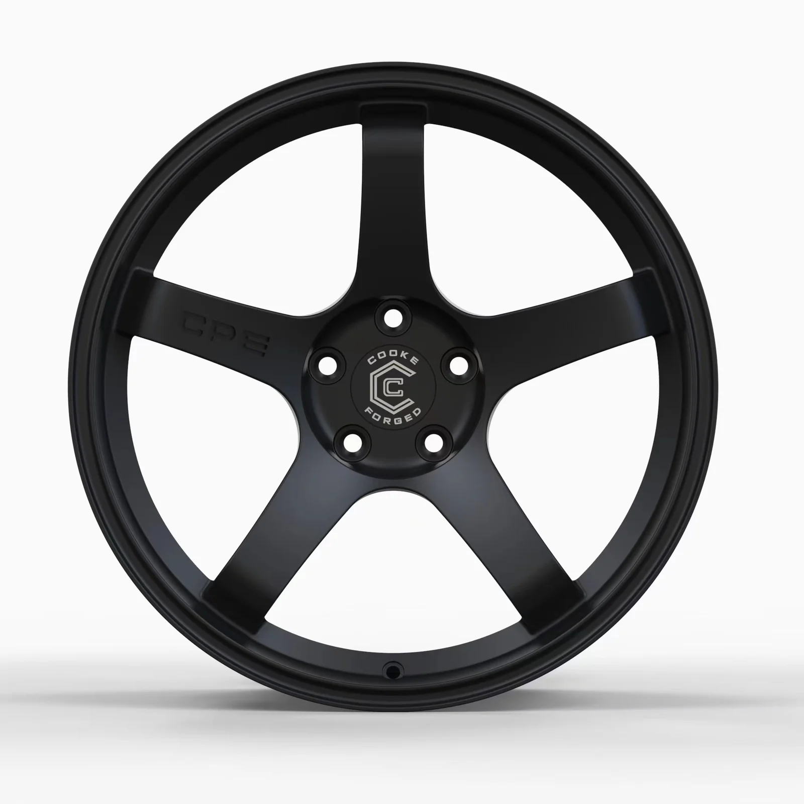 Black five-spoke Cooke Forged alloy wheel on white background