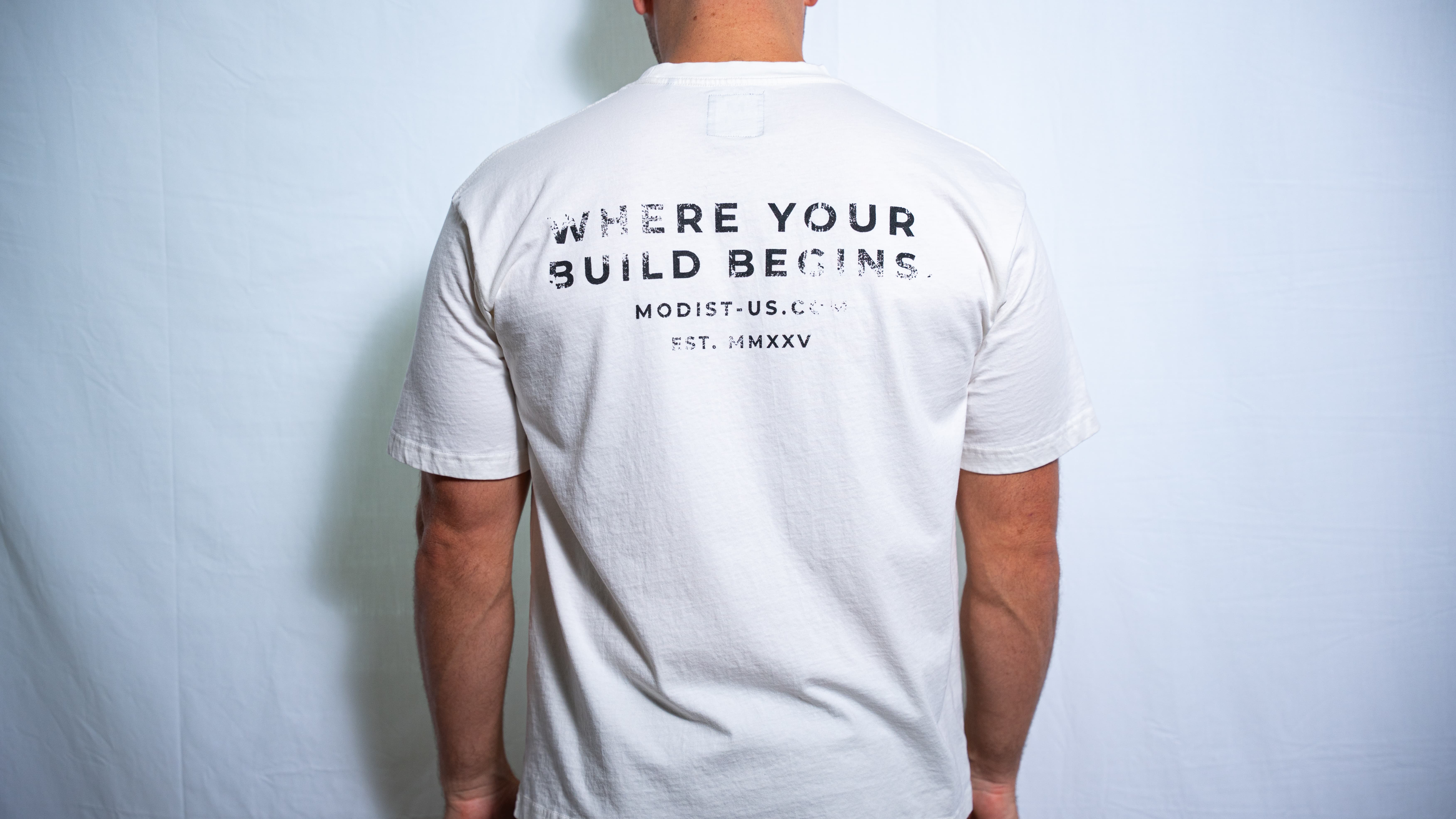 Minimal by design. Built from premium heavyweight cotton with a custom athletic oversized fit, weathered graphics, and custom woven Modist tags.
