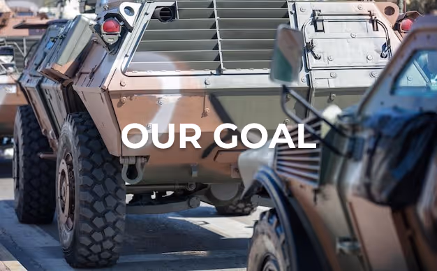 Close-up of military armored vehicles with text overlay reading 'OUR GOAL'.