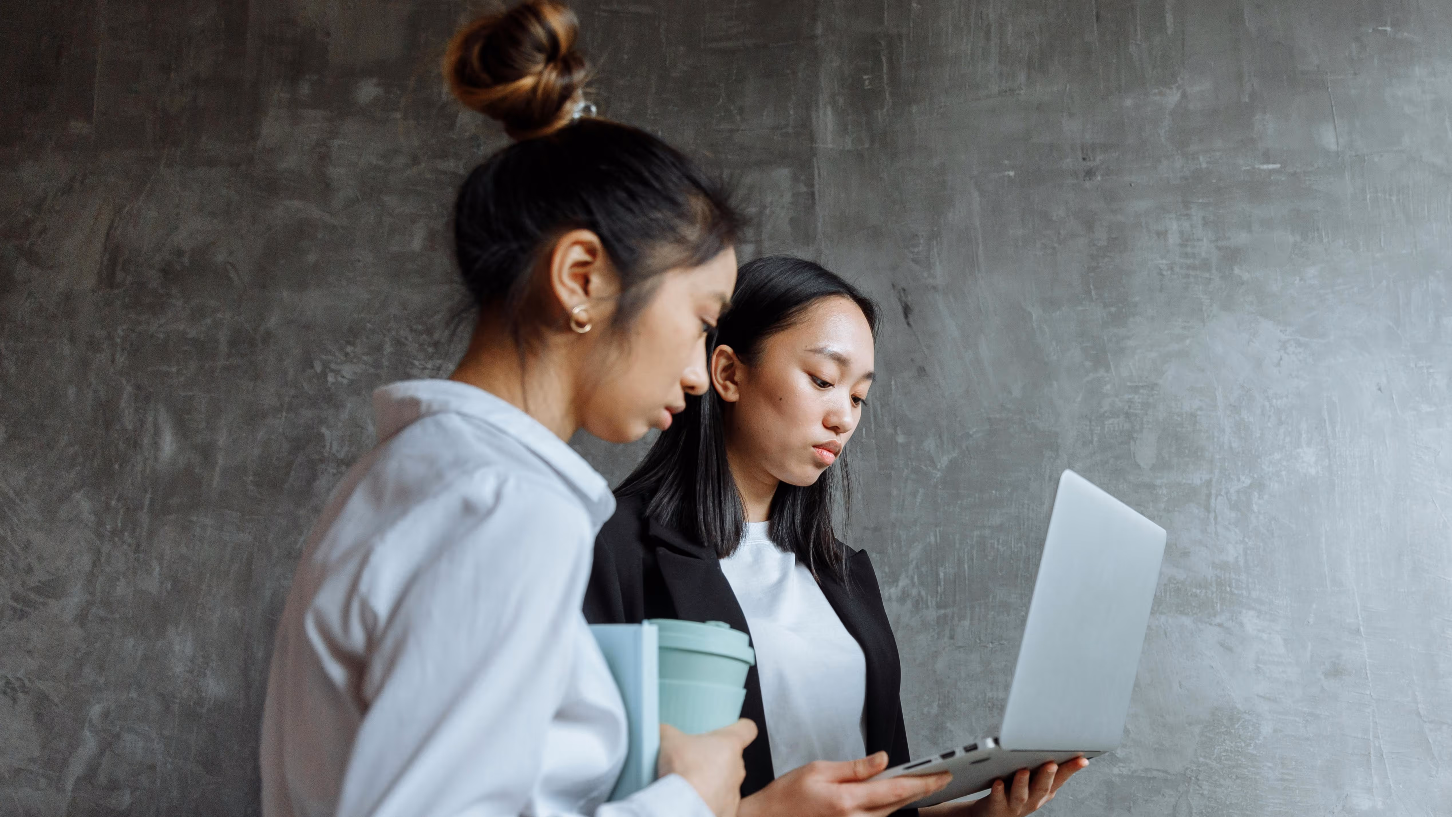 Two ladies collaborating on work