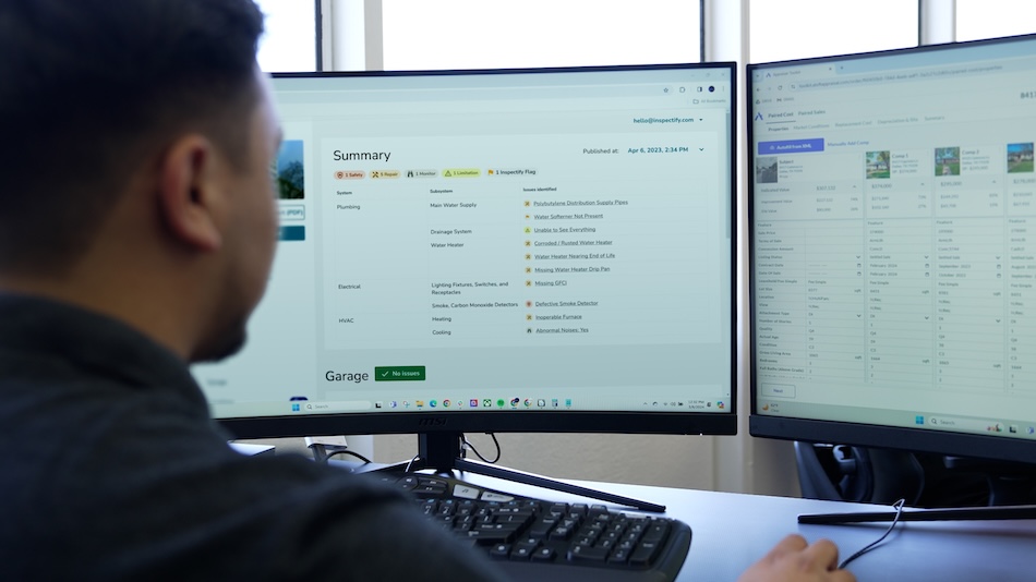 An Appraiser creating a valuation report using Inspectify Inspection report data on a computer.