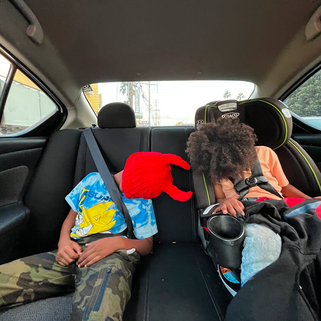 image of masked people in car