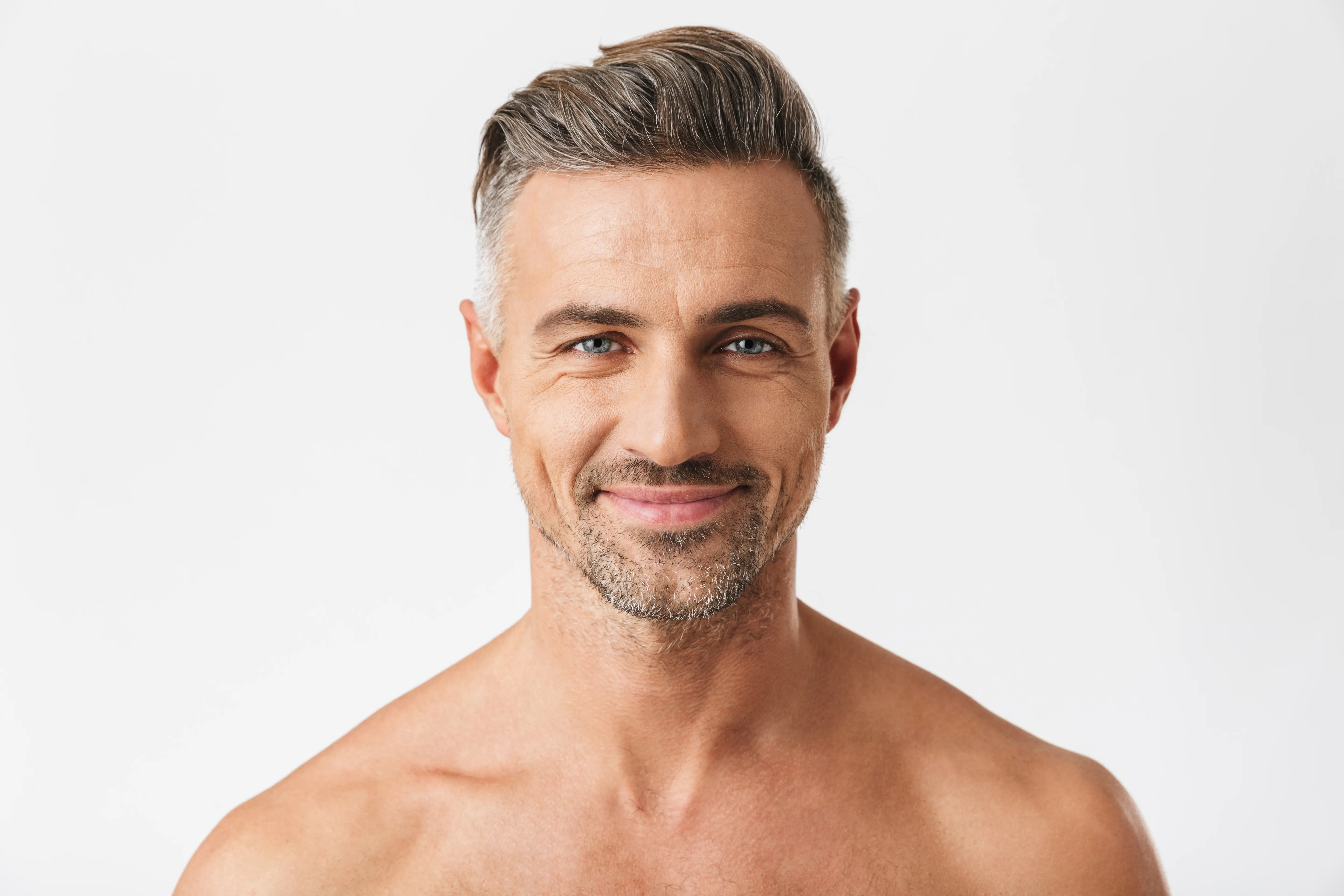 A man with a goatee smiles at the camera.