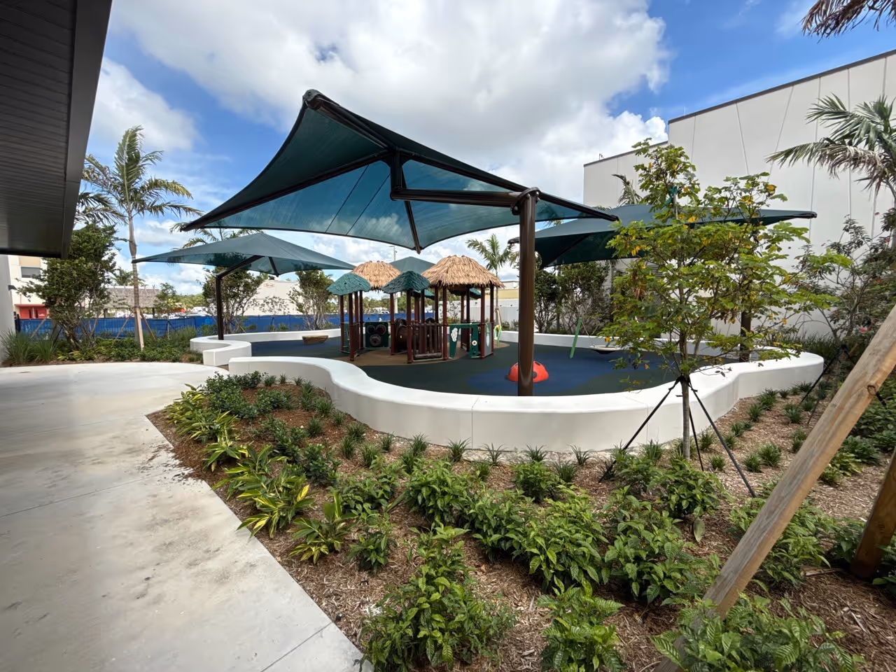 Exterior view of a shaded courtyard in school commercial construction project in Broward County.