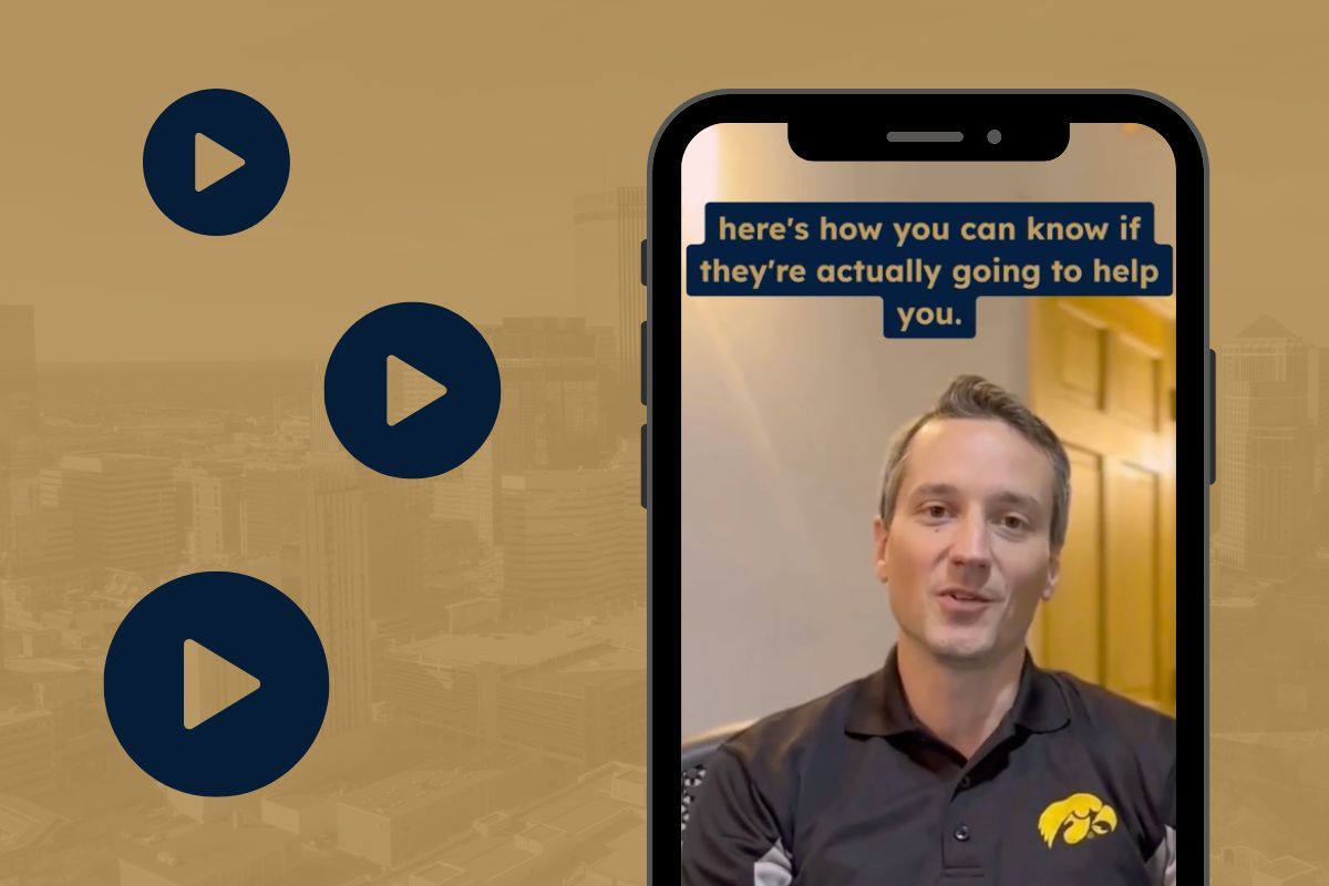 Three play button icons arranged in an order that mimics the Journey Search Partners logo beside a smartphone with a paused video of the company’s Vice President Karl Amlie
