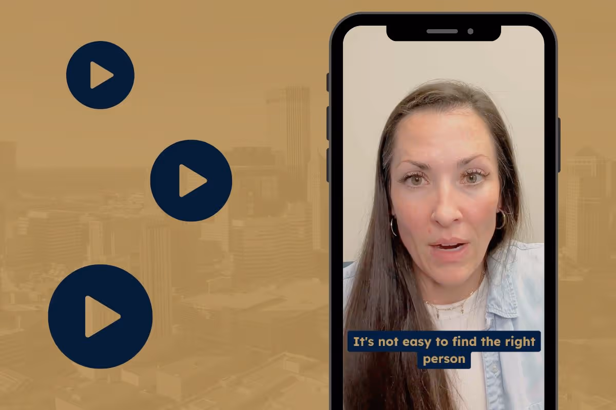 A smartphone with a paused video of Director of Operations and Account Management Liv Sampair.