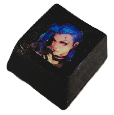 Keycap encapsulado con imagen de Jinx de League of Legends