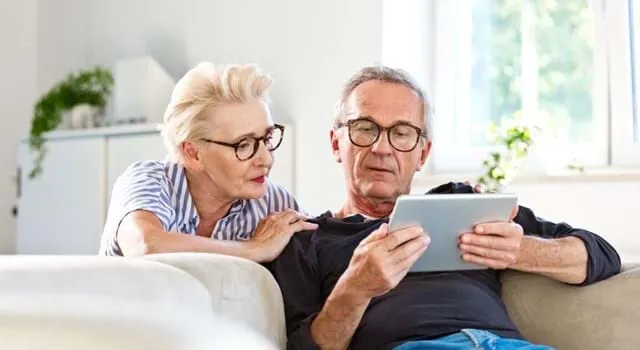 Older couple looking at an ipad