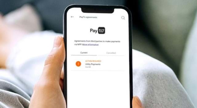 A phone with payID showing on the screen