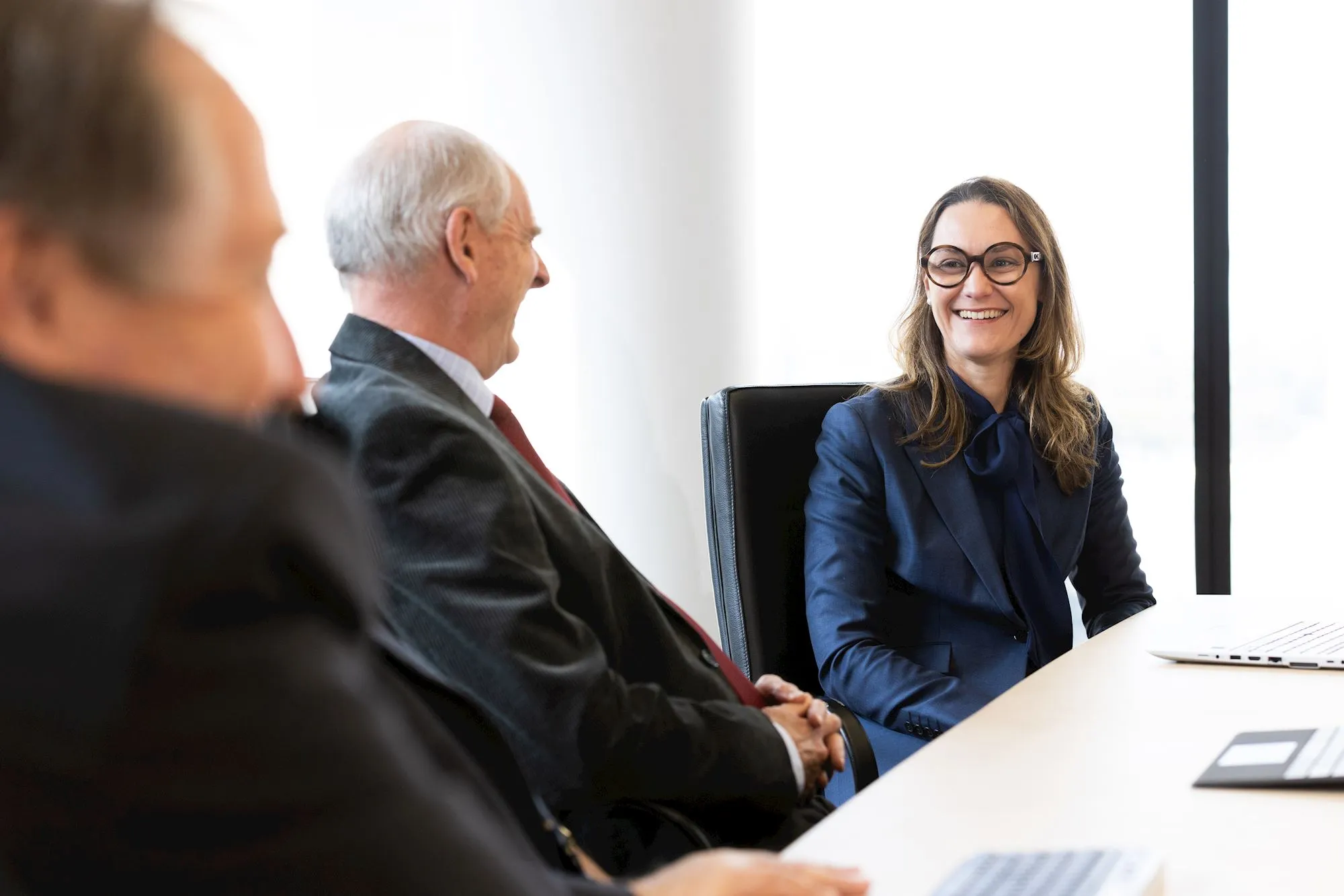 Qudos Bank Directors in the board room with a focus on Clare