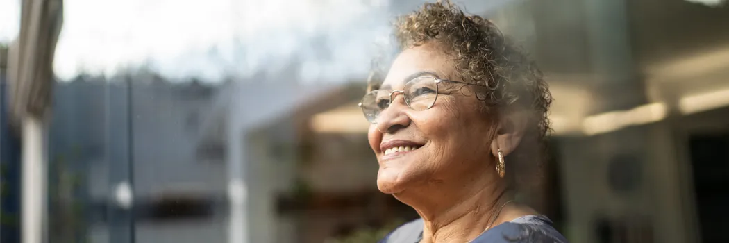 Older women smiling looking out the window