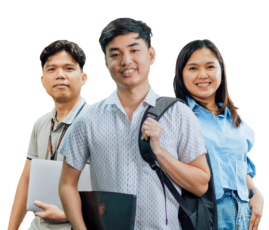 Three young adults standing together, two holding laptops and one wearing a backpack, smiling at the camera.
