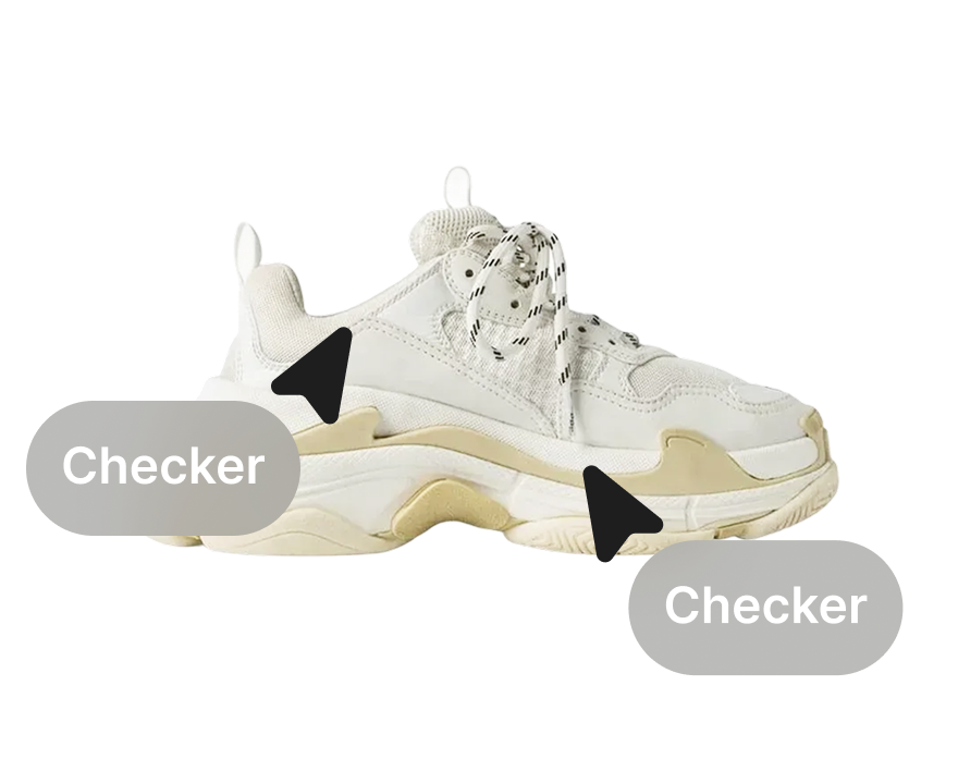 A sneaker being checked by two professionals.