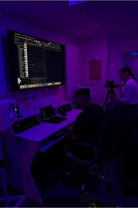 Purple-lit workspace photo with digital marketing setup.