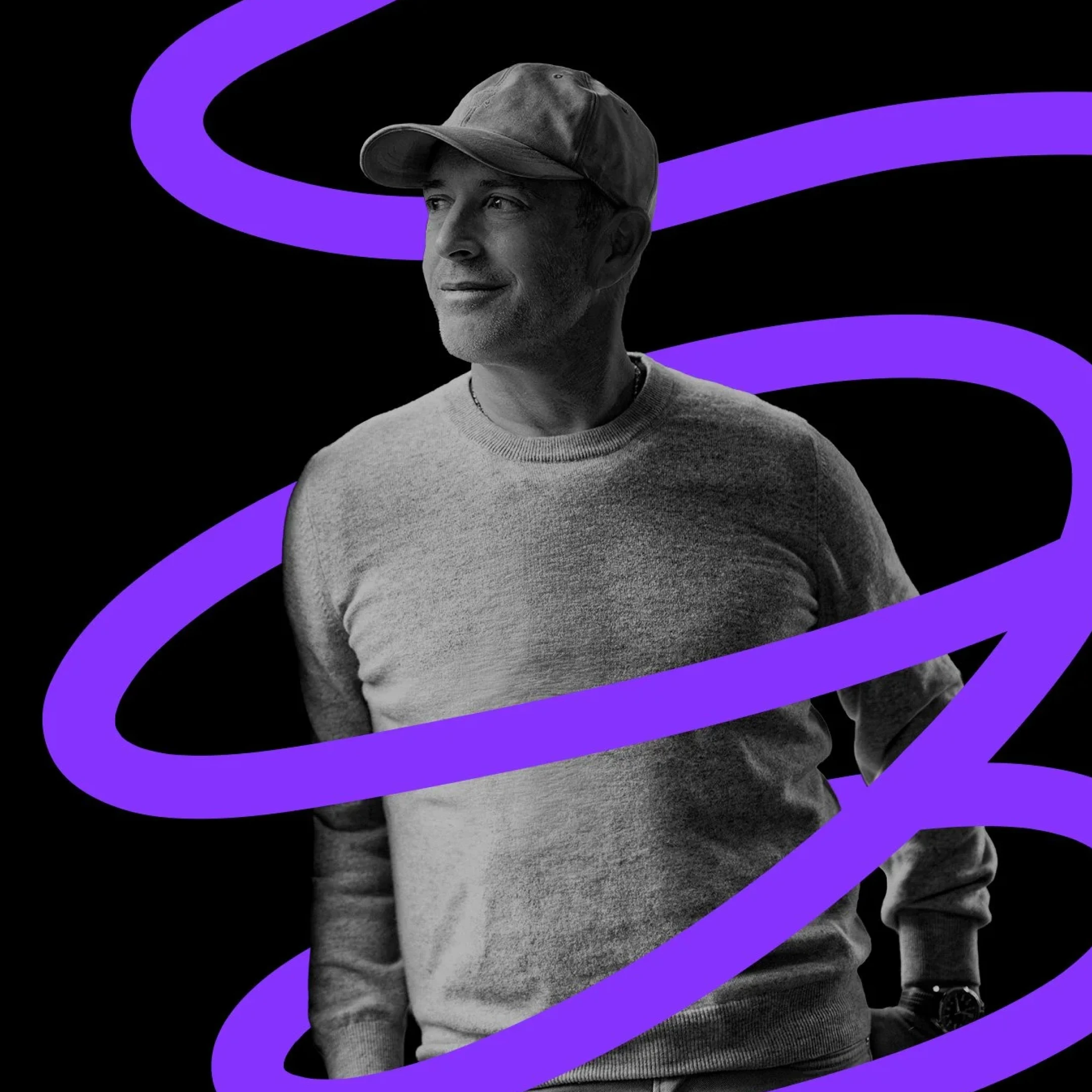 Two people wearing headphones sitting and talking into microphones in a modern podcast studio with a large illuminated G on the wall.