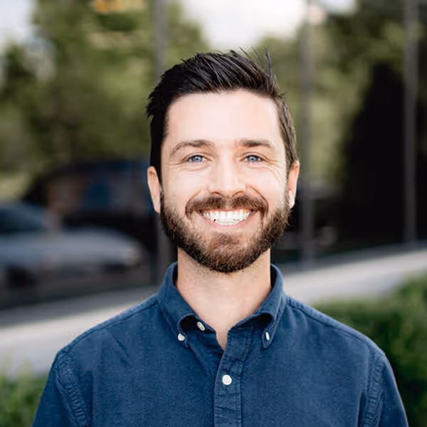 a man smiling at the camera