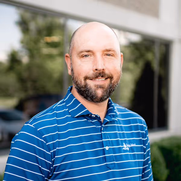 a man in a blue shirt