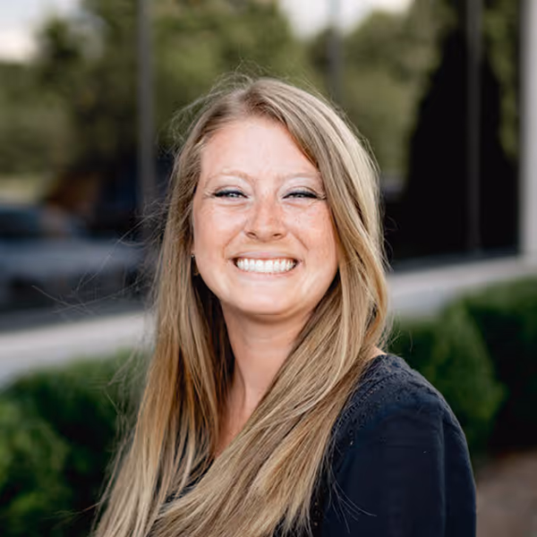 a woman smiling at the camera