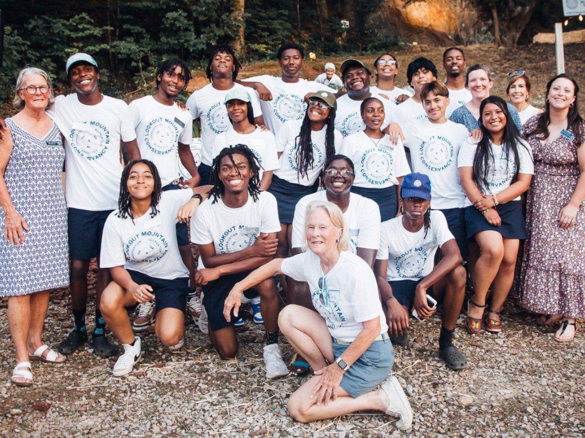 Group photo of the Summer Interns wearing white T-shirts outside at Lookout Mountain Conservancy's 2023 Shrimp Boil