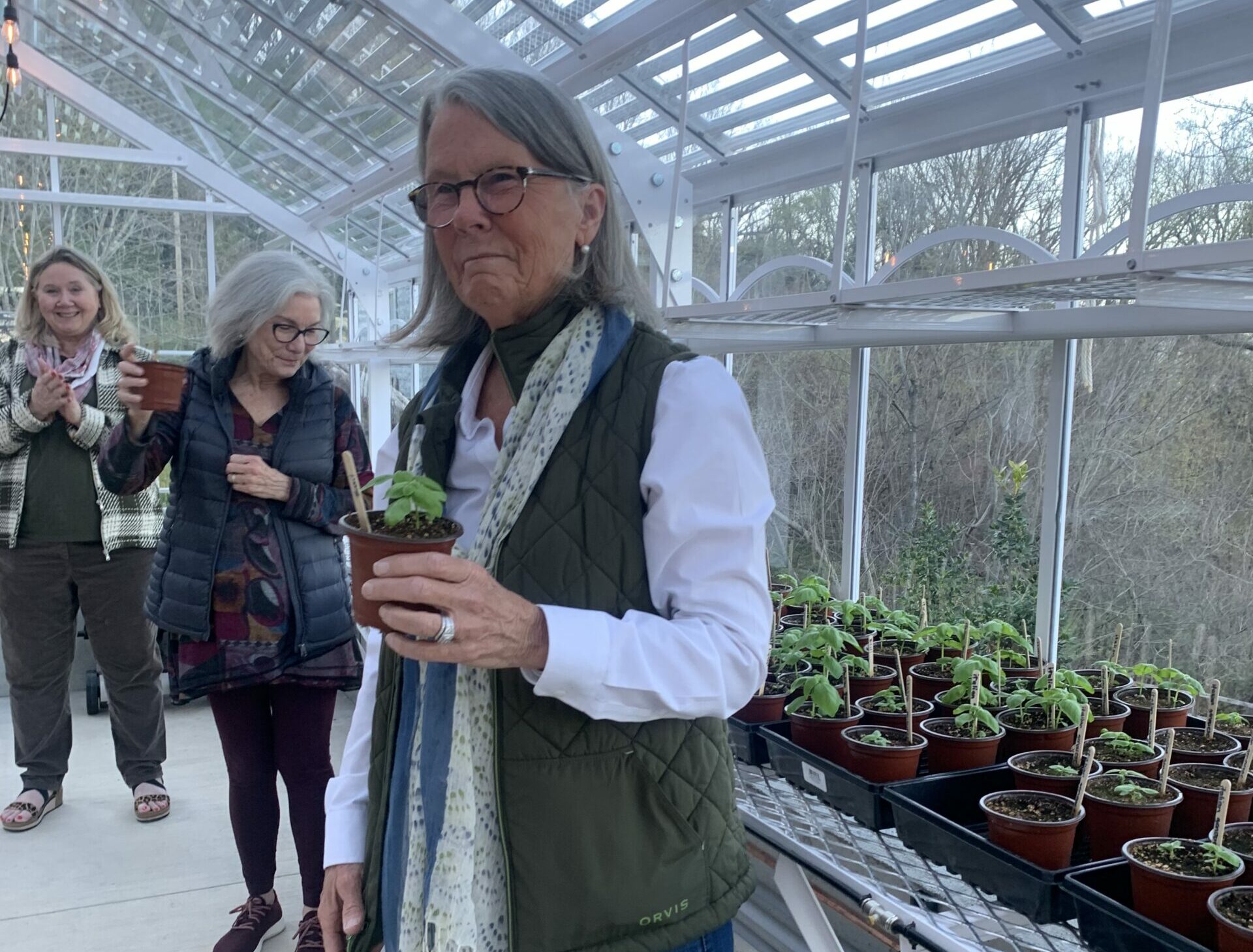 Robyn toasting to the greenhouse name dedication
