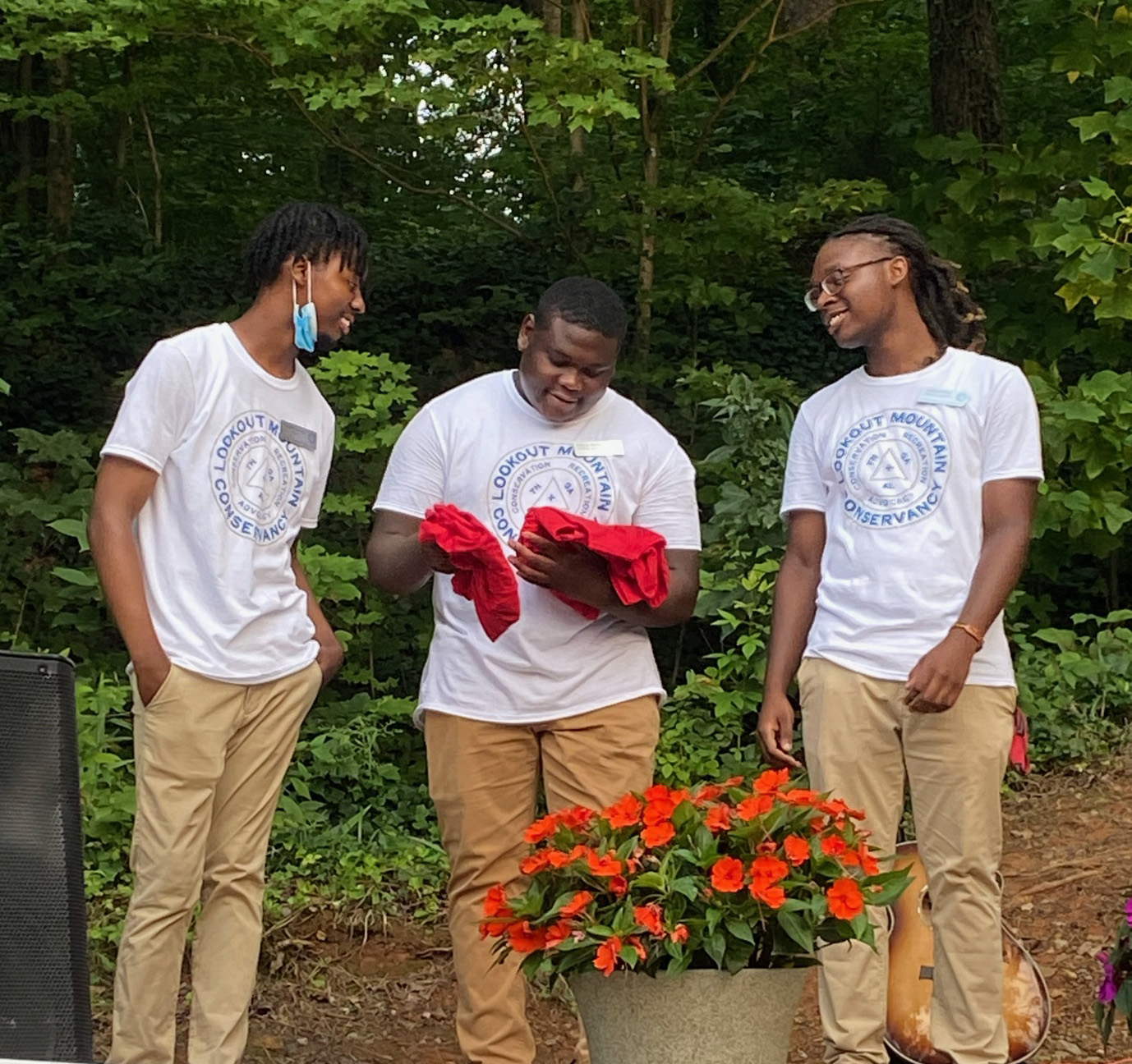 Intern JaMaal receiving his red shirts