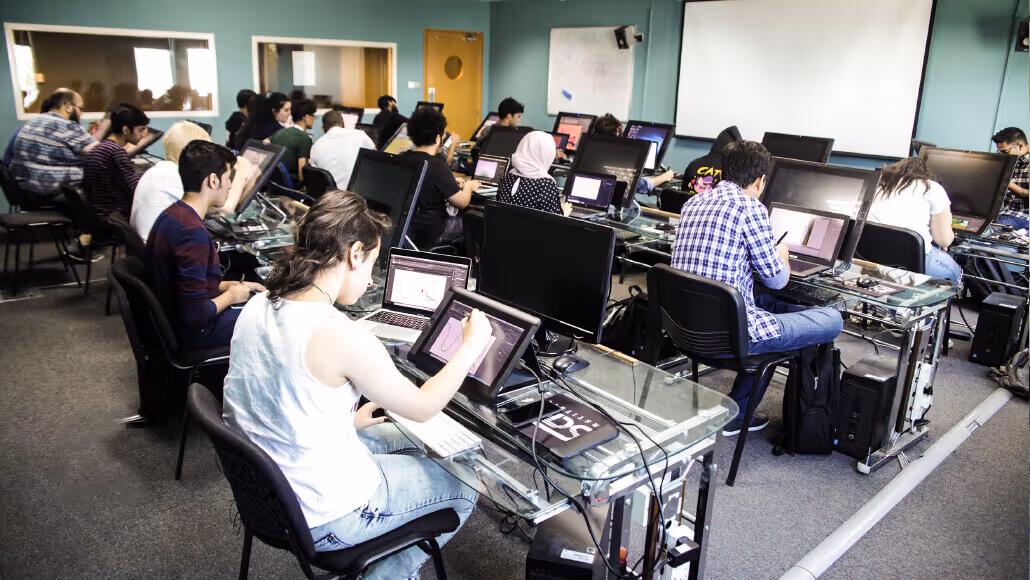 Students using digital tablets in Dubai Knowledge Park classroom.
