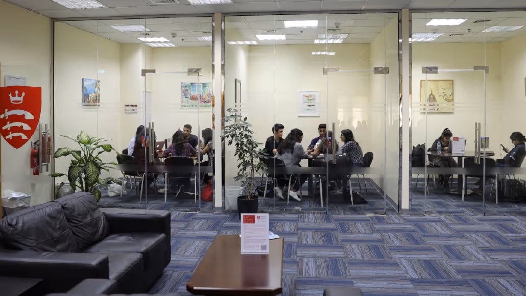 Team collaborating inside a meeting room at Dubai Knowledge Park.