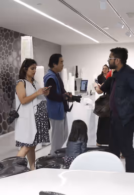 Visitors interacting inside a modern showroom at Dubai Knowledge Park.