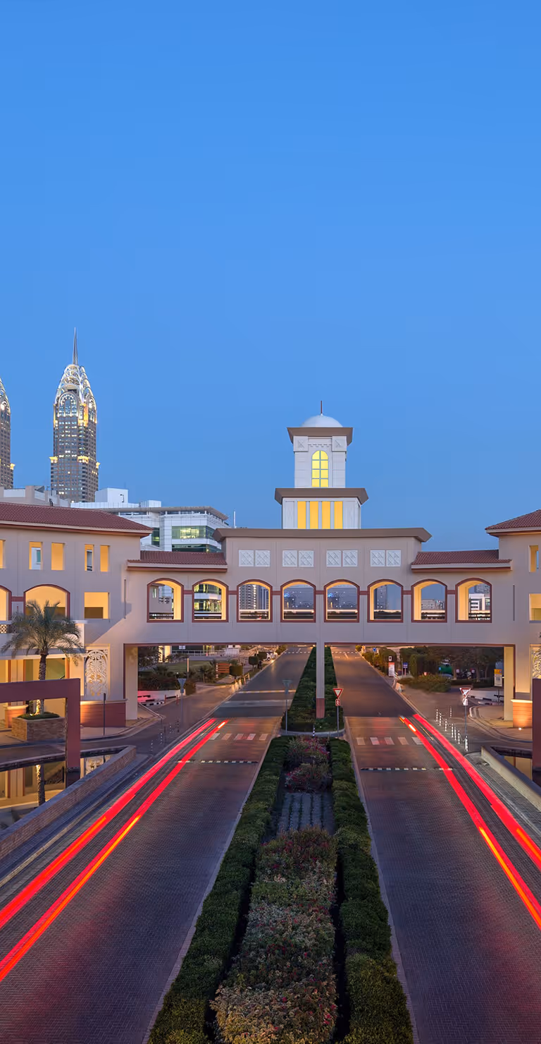 Evening view of Dubai Outsource City from afar Dubai Knowledge Park: Premier Talent Hub at HR Summit