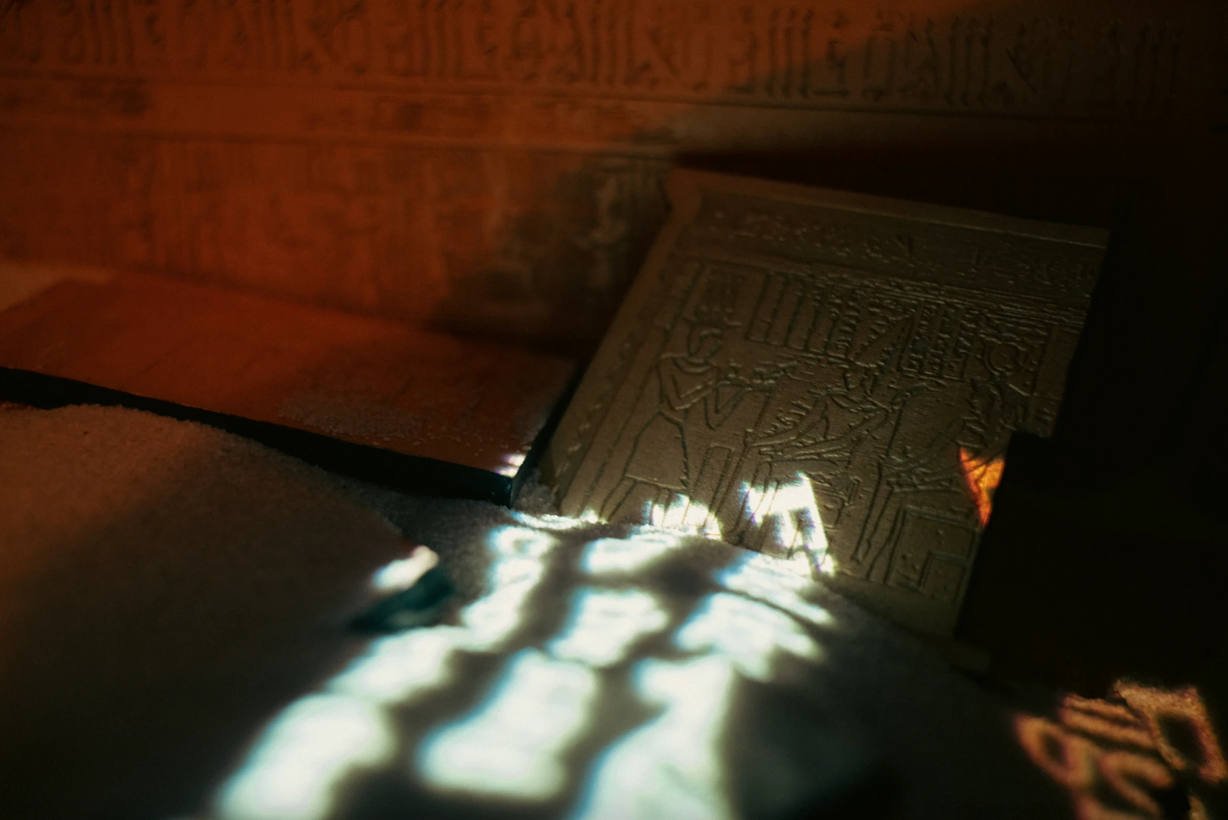 A piece puzzle lying on a bed of sand